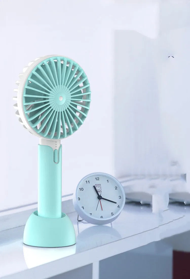 Blue mini handheld electric fan with USB cable showing three-speed control buttons