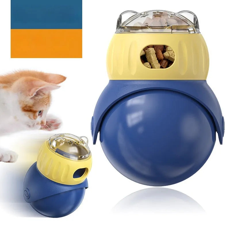 Yellow and blue owl-shaped plastic cat puzzle feeder with a food tumbler mechanism.