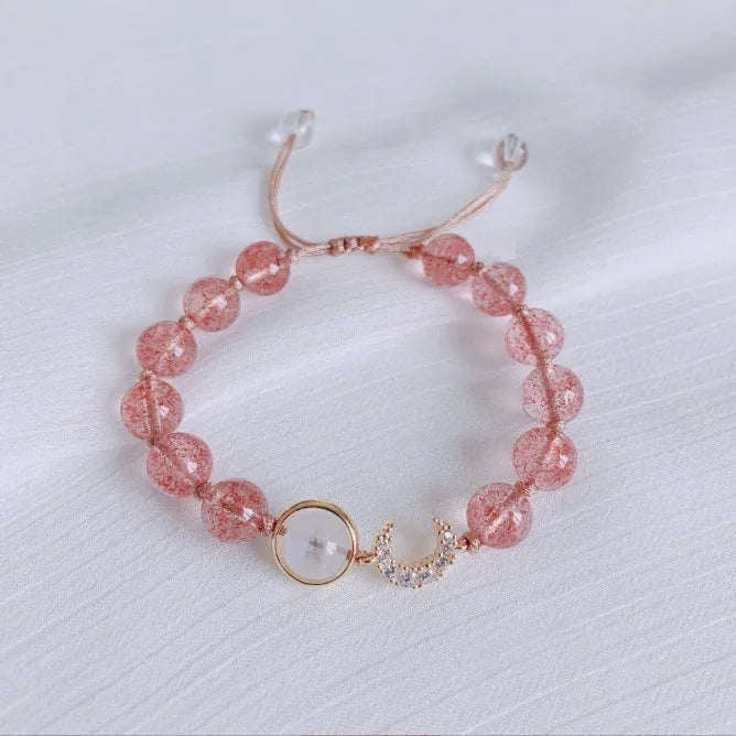Handmade women's bracelet with strawberry quartz beads and Hetian jade peach blossom details.