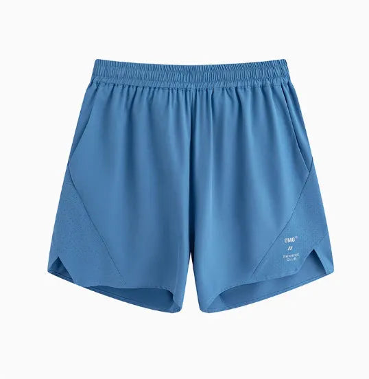 Men's black running shorts with laser stitching on a grey background, showing stretch fabric.