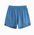 Men's black running shorts with laser stitching on a grey background, showing stretch fabric.