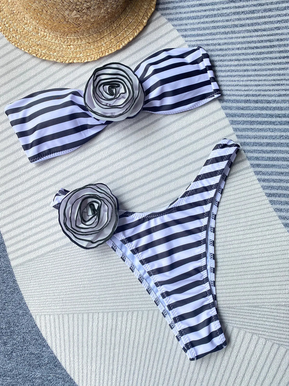 Women's cross-back bikini swimsuit with three-dimensional floral detailing in striped pattern