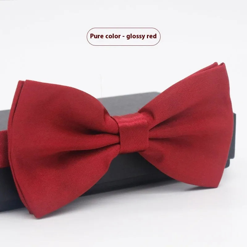 Solid colour flat head bow tie for formal wear in multiple colours including black, red, and blue.