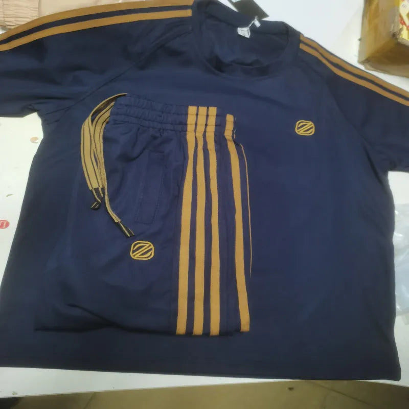 Men's blue short sleeve polyester suit with separate top and trousers for sports wear