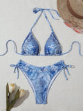 Women's denim blue printed bikini swimsuit with decorative strap detailing