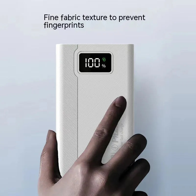 Black and white plastic power bank showing dimensions of 150 by 76 millimetres
