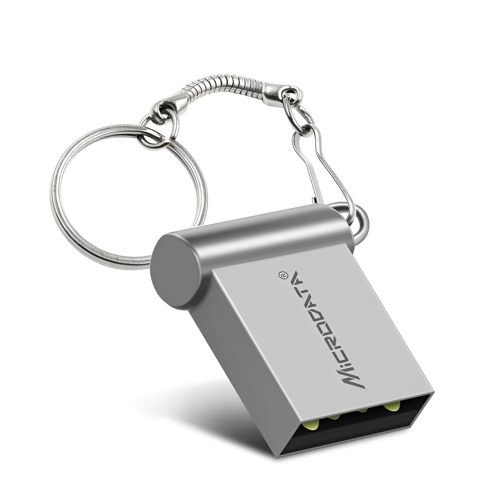 Silver car-shaped metal USB flash drive on a chain, shown next to a laptop.