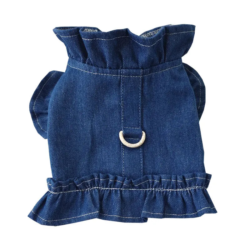 Blue denim dog dress with chest ruffles and a leash hook on the back, shown in dark blue and light blue.