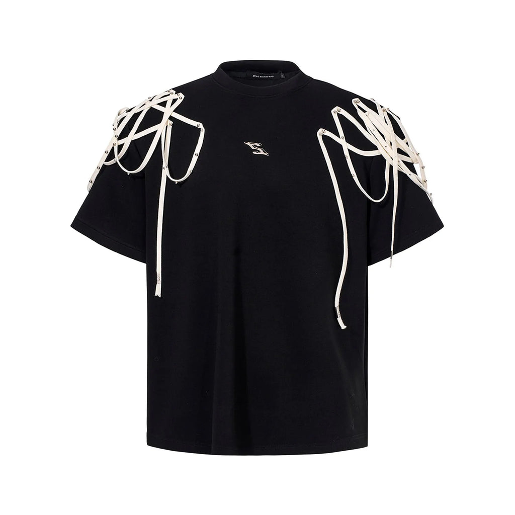 Black loose-fit short-sleeve t-shirt with padded shoulders featuring a decorative rivet and ribbon detail.