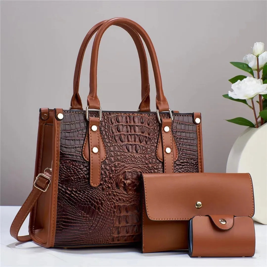 PU leather three-piece bag set showing bucket crossbody bag, wallet and card holder with contrast trim in burgundy colour