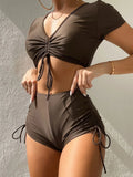 Women's lace-up bow two-piece swimsuit in dark green with separate top and shorts