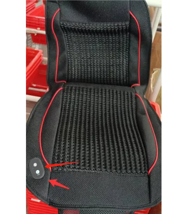Square black car ventilation seat cushion on a car seat with a connected power cord.