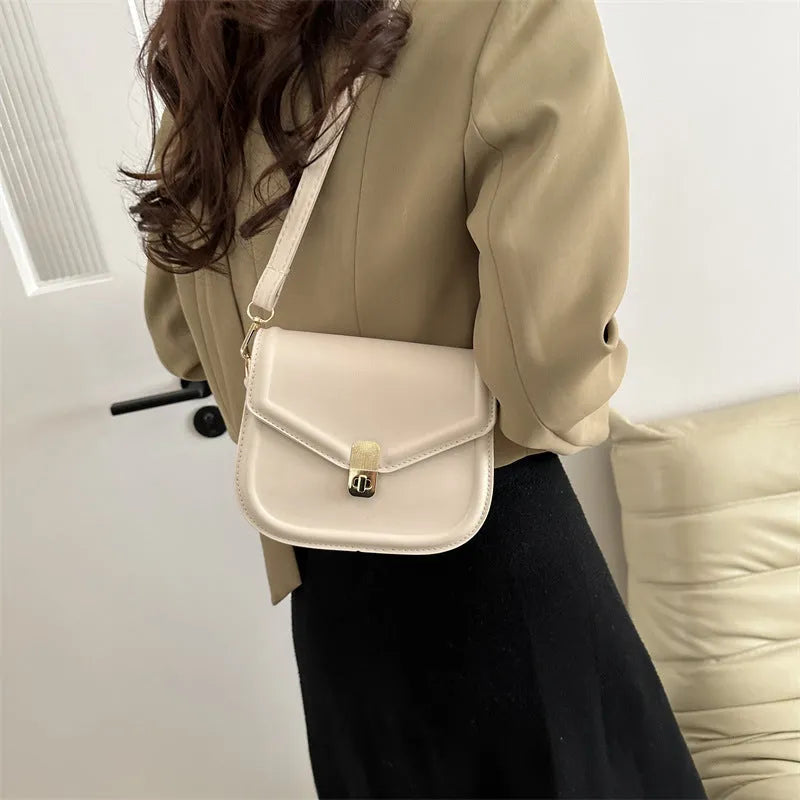 Soft PU leather clamshell messenger bag in horizontal square design shown in available colours.