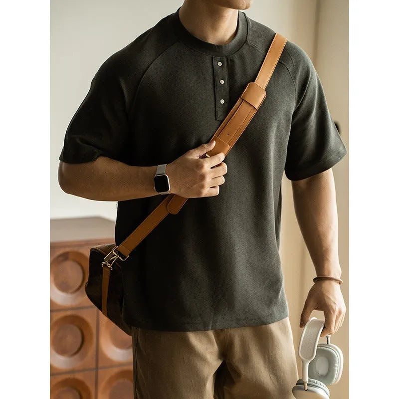 Casual loose top with raglan sleeves in terry texture fabric available in smoky grey, white, and black colours
