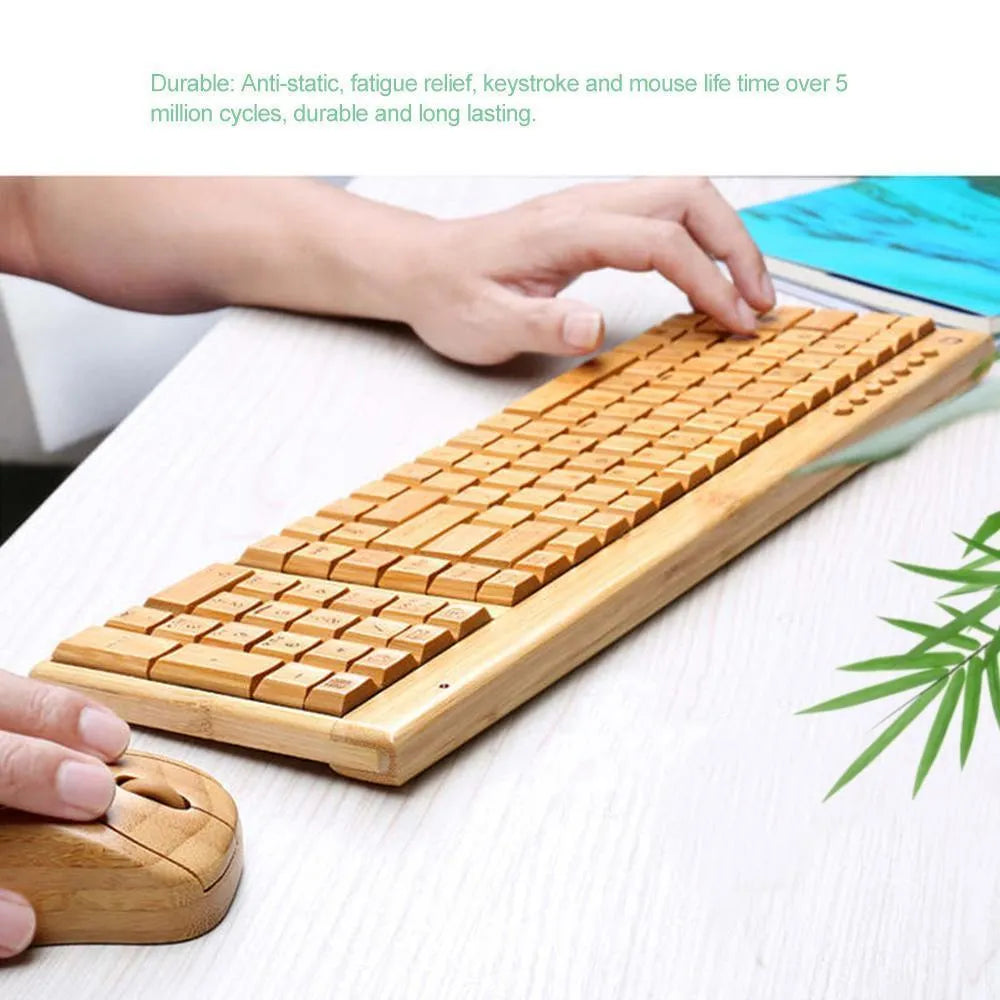 Bamboo wireless keyboard and mouse set on a wooden desk, natural finish, full-size keyboard and compact mouse