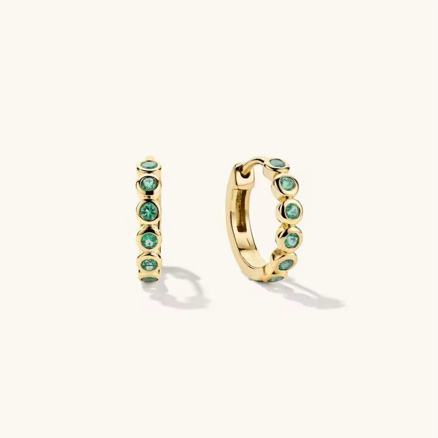 Gold S925 sterling silver geometric stud earrings with inlaid zircon on a white background