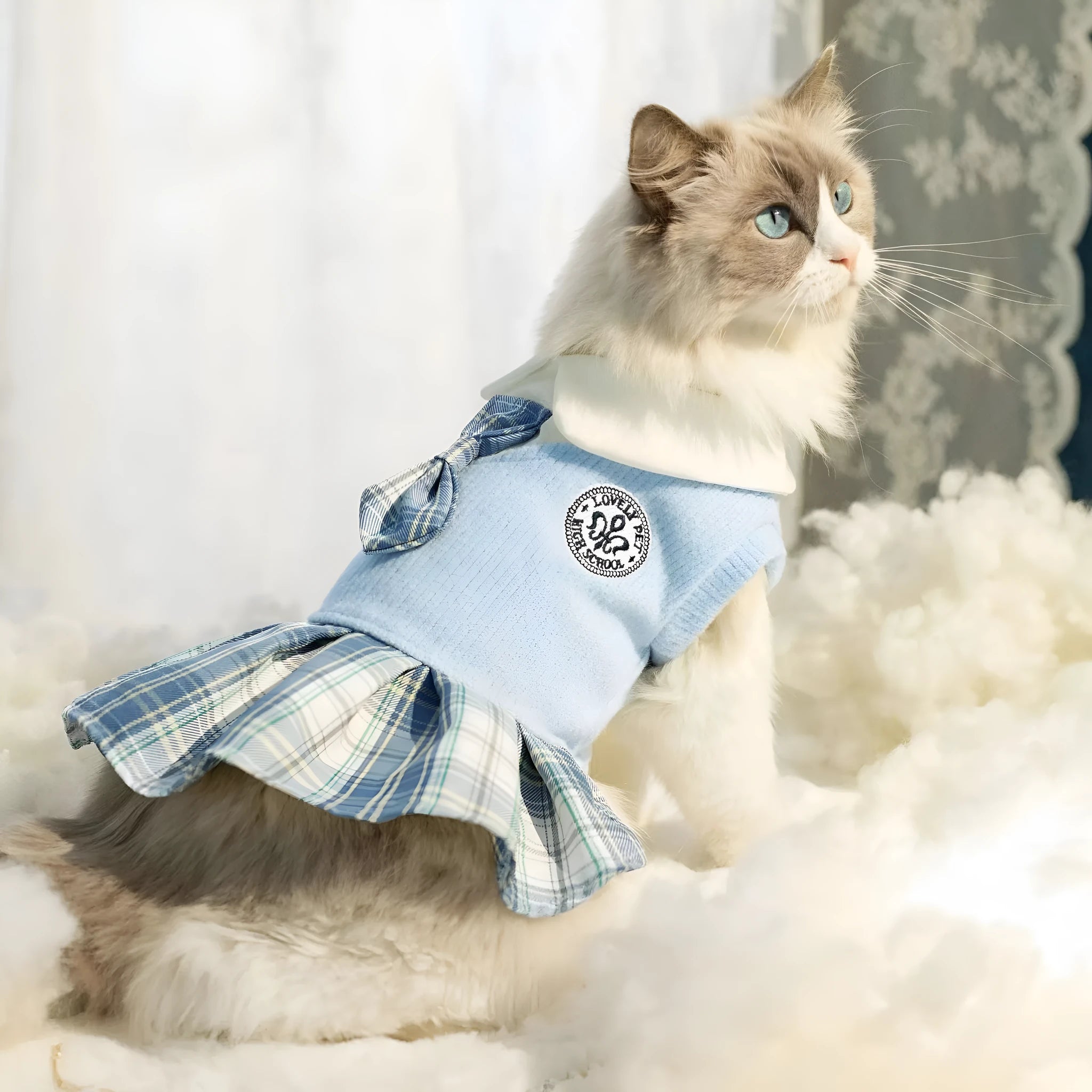 A pink, blue, or green tartan skirt for small dogs or cats in a princess costume style.