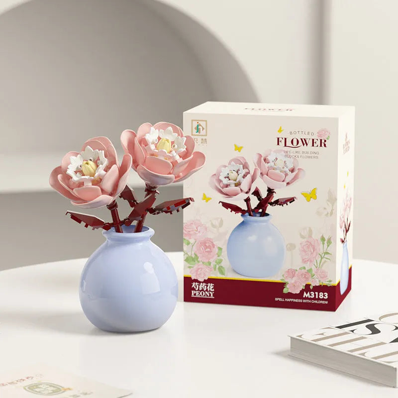 Assembled plastic building block flower in vase on tabletop