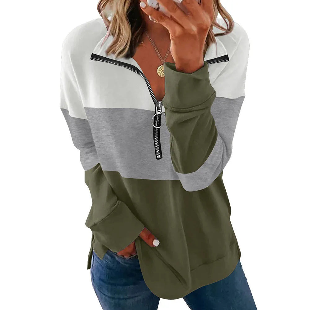 A woman modelling a loose-fitting long-sleeved leopard print sweater in a casual setting.