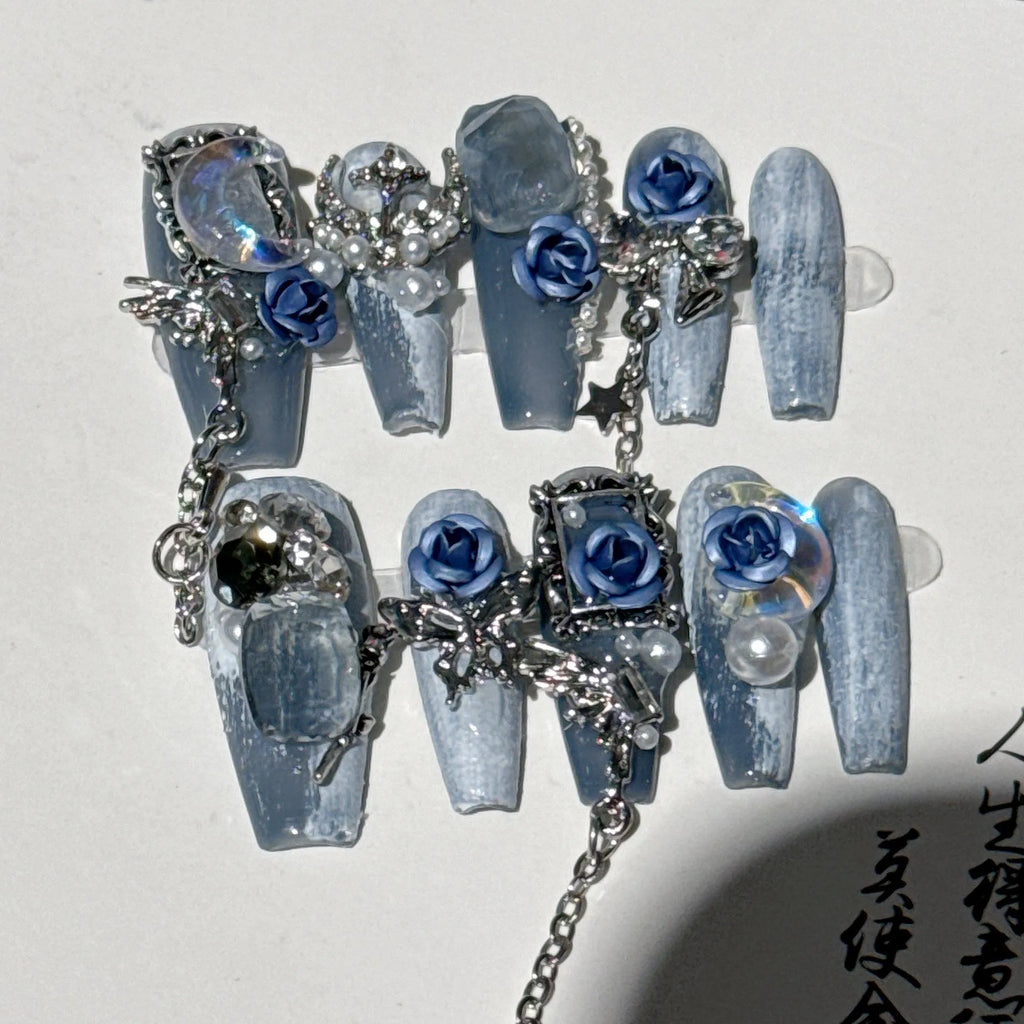 Blue plastic manicure armour suit with ornate rose and tulip floral patterns for evening wear.