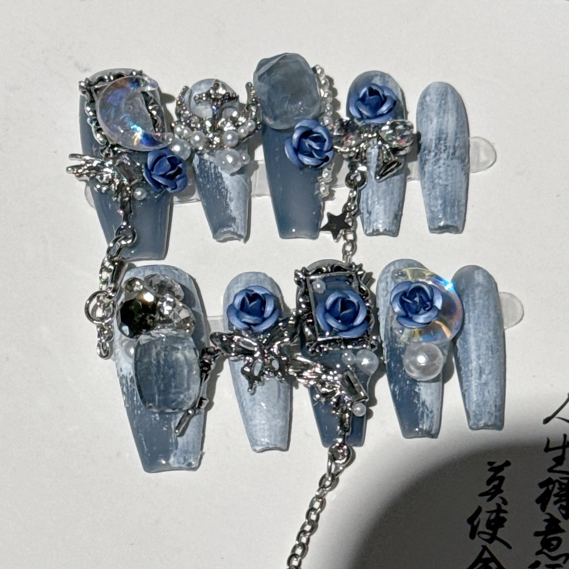 Blue plastic manicure armour suit with ornate rose and tulip floral patterns for evening wear.