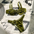 Women's 3D floral swimsuit briefs in green with matching bra, laid flat.