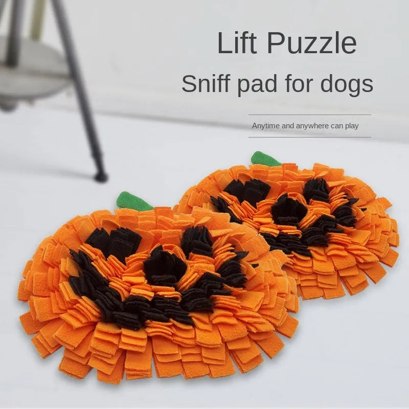 Orange pumpkin-shaped dog sniffing mat with textured fur surface for slow feeding.