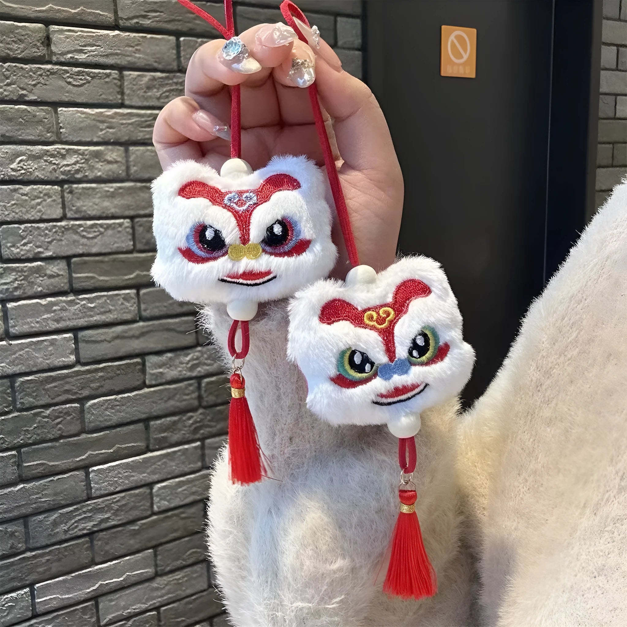 Handmade blue and yellow Chinese style plush lion keychain ornament with star stone decoration.