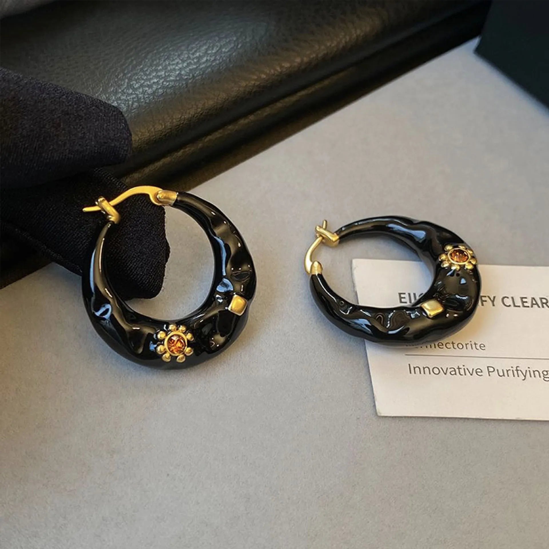 Hong Kong style retro ear studs with rhinestone decoration and dripping oil finish in black and red colour options