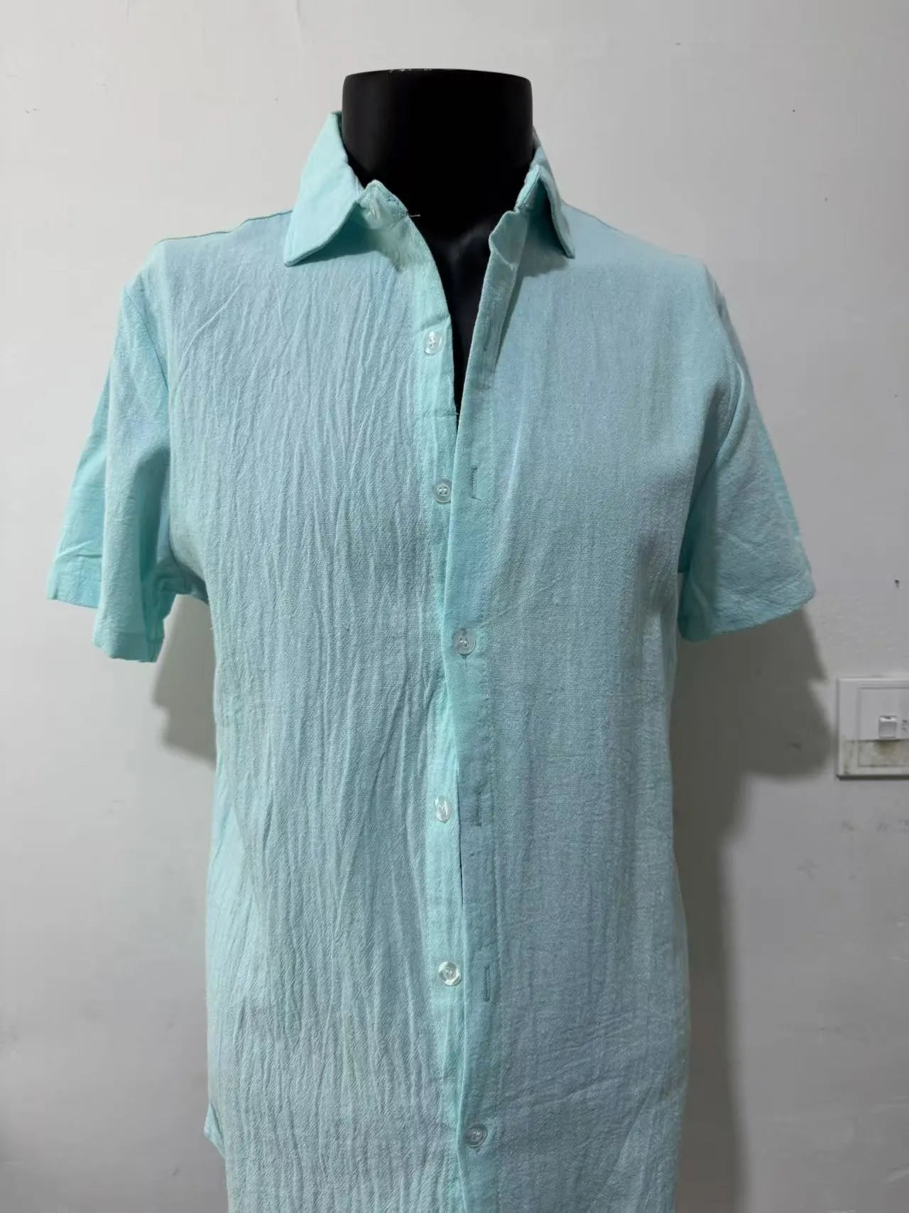 Men's loose fit short sleeve shirt in a cotton linen blend fabric, shown in a solid colour.