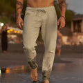 Men's solid colour cotton linen loose beach casual pants with elastic waist, shown in grey on a plain background