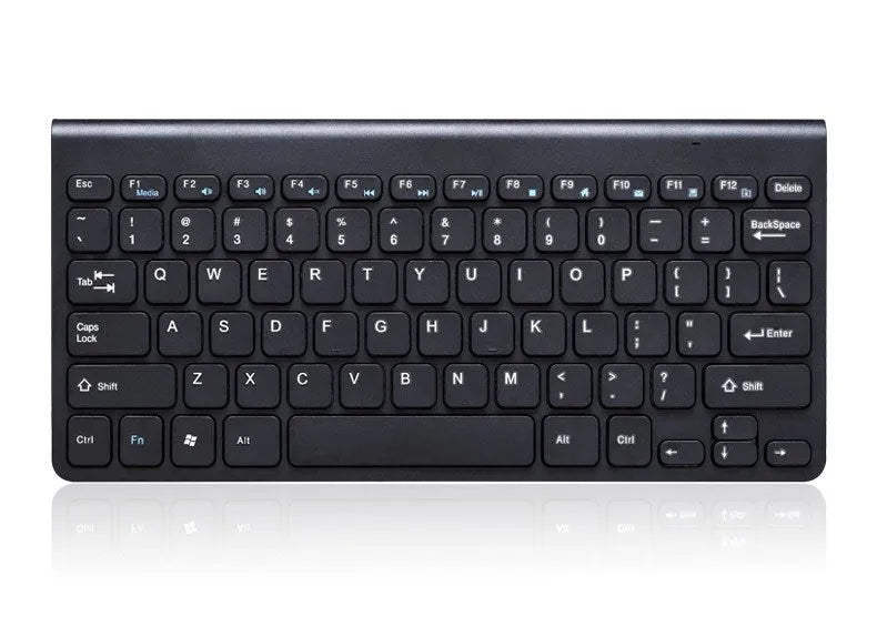 Black wireless keyboard and mouse set with USB receiver on wooden desk