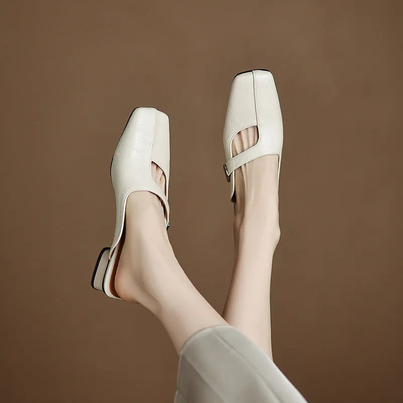 Pair of low heel outdoor slippers with a square toe in a solid colour
