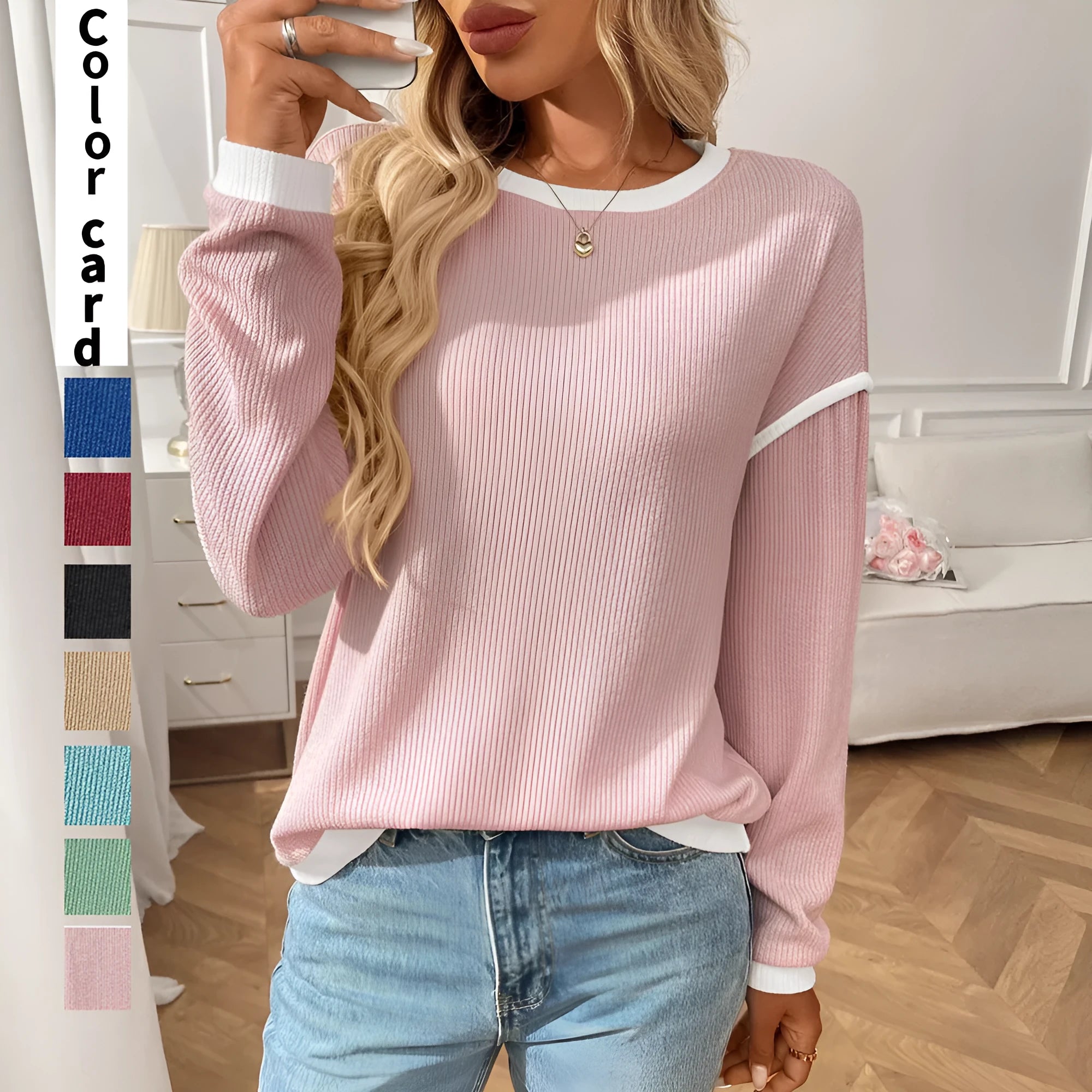 A woman's loose-fitting long sleeve polyester pullover top in a light aqua blue colour.