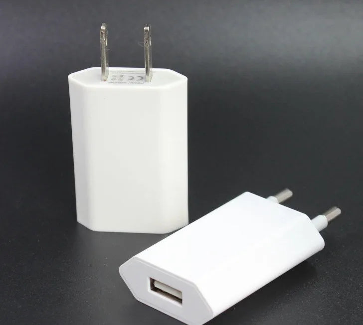 White USB travel charger and cable for iPhone and iPad models, showing 5V 2A output specification.