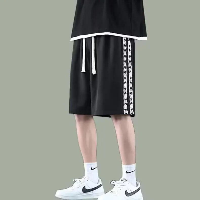 Men's black baggy track pants with micro elasticity in loose sports fit