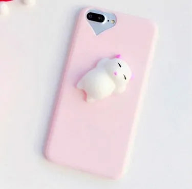 Soft silicone iPhone case with a raised 3D cartoon cat design in pink.