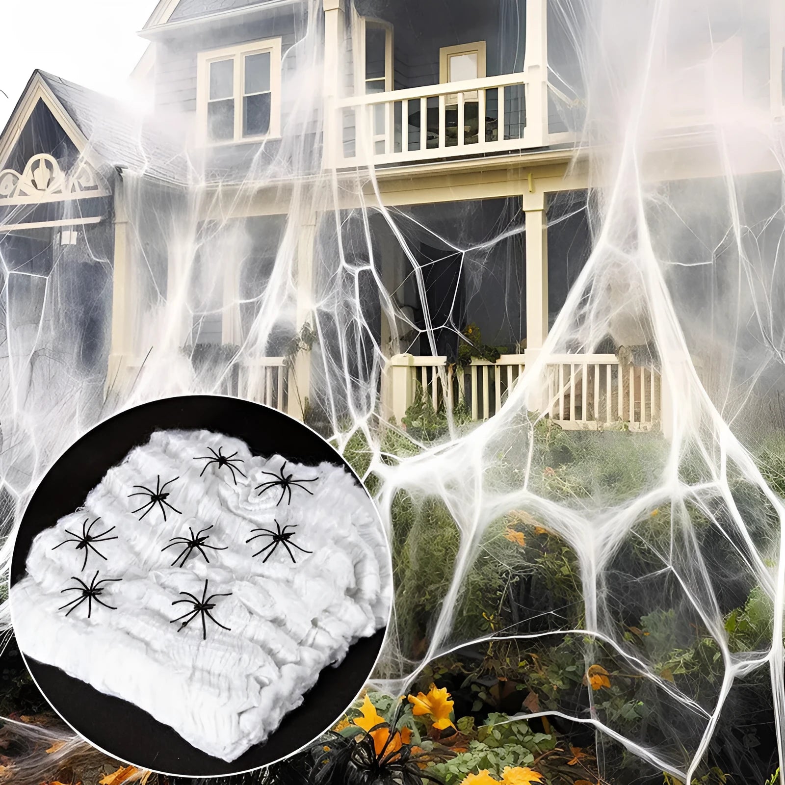 White cotton spider web Halloween decoration draped over a branch with plastic spiders.