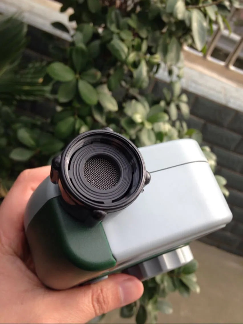Green garden irrigation controller with LCD display and rotary dial for automatic hose timer