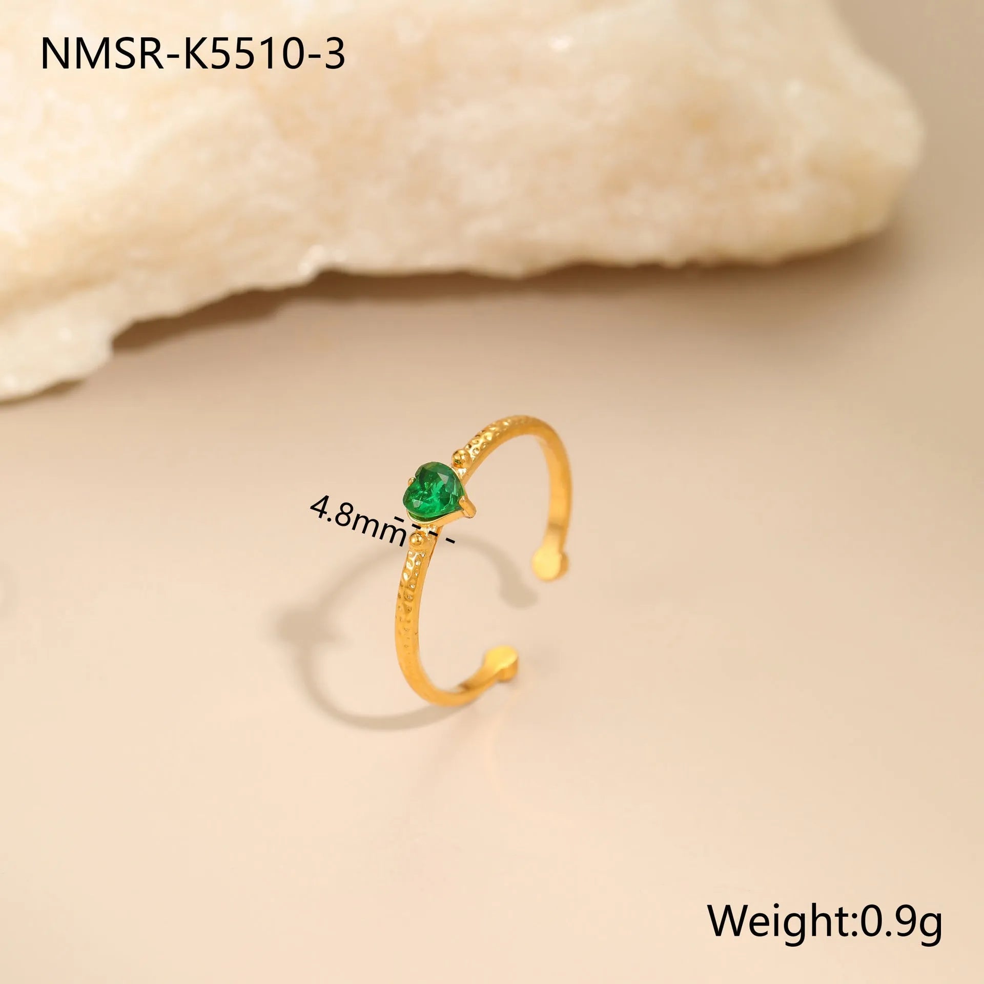 Open-ended stainless steel ring with a geometric heart shape and inlaid green zircon stone.