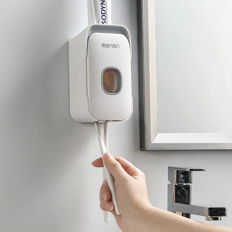 Automatic toothpaste dispenser in blue colour made from ABS plastic with a wall-mount design.