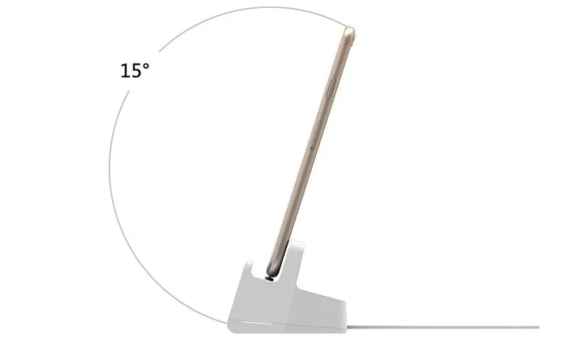 White headphone charging base stand on a desktop holding a gaming headset