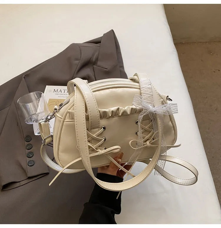 Women's casual PU shoulder handbag with a bandage bow and internal phone pocket in beige, black, blue, or pink.