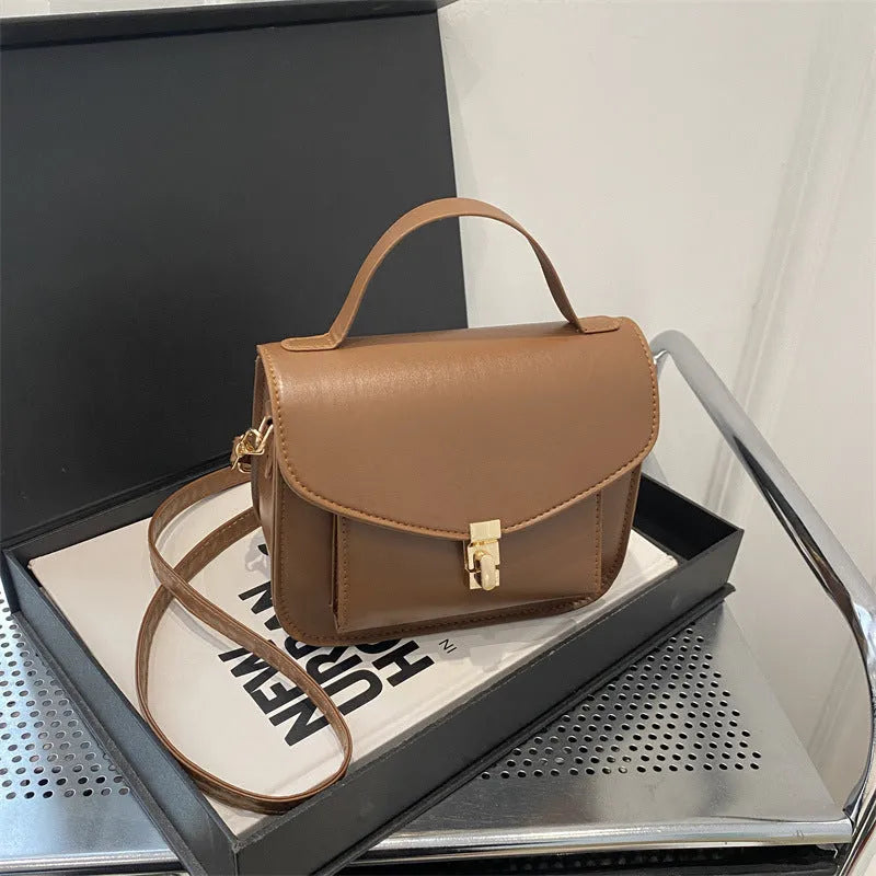 Retro style shoulder messenger bag in horizontal square shape with document compartment