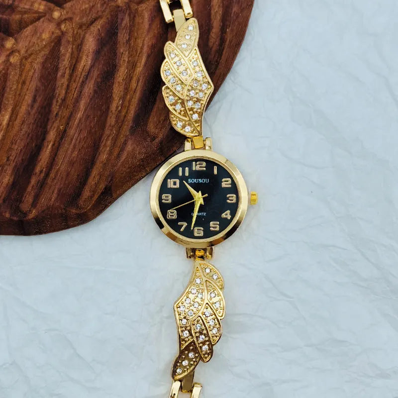 Women's stainless steel watch with round dial on wrist, showing Vachette clasp.
