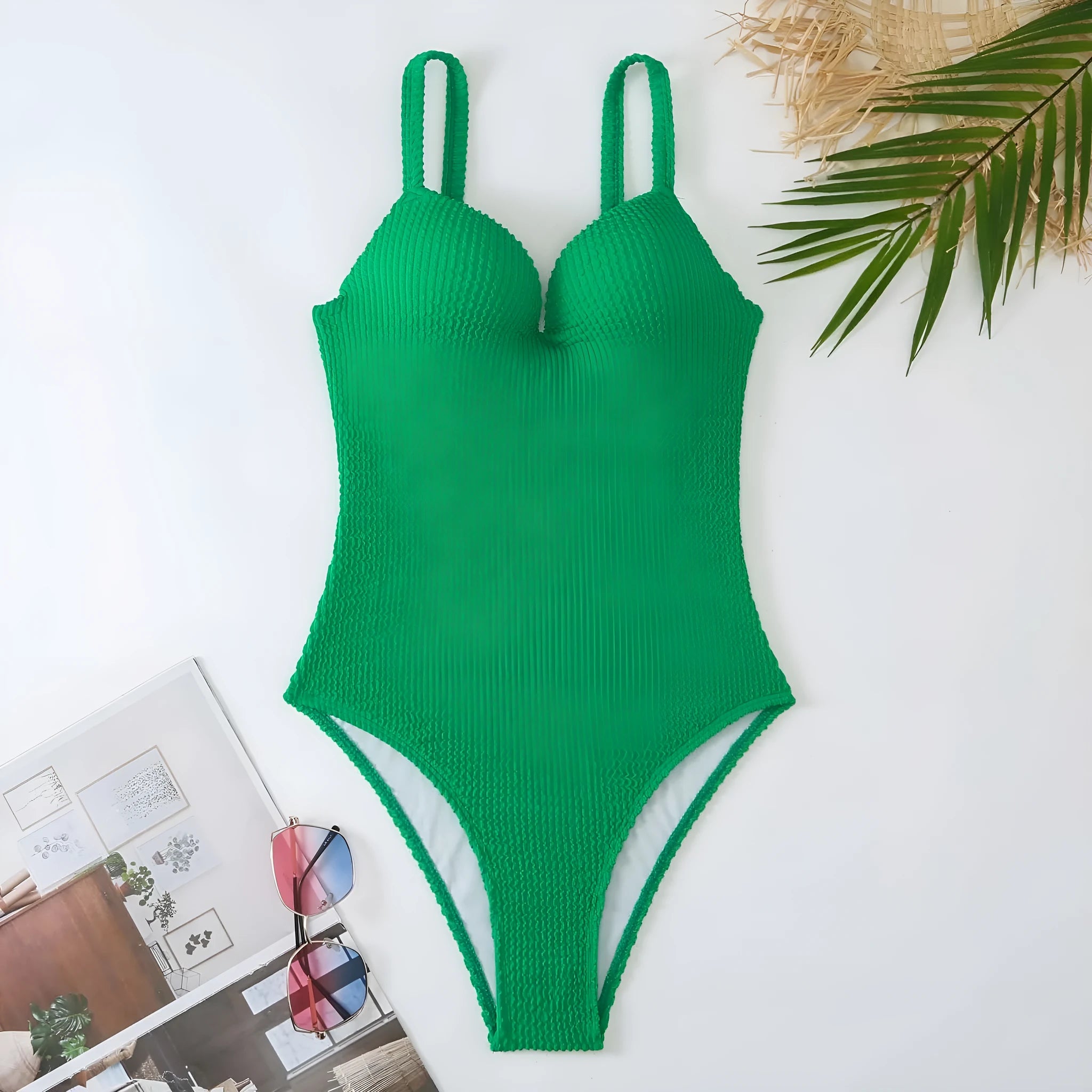Women's black sunk stripe one-piece swimsuit made from polyester, shown on a mannequin.