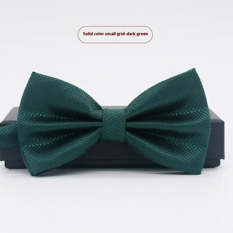 Solid colour flat head bow tie for formal wear in multiple colours including black, red, and blue.