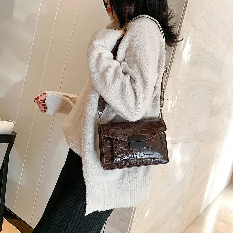 Vintage PU leather crossbody bag showing black, dark brown, khaki and red colour options