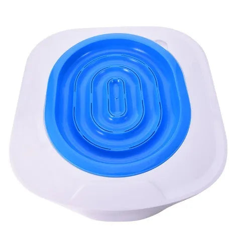 Blue cat toilet trainer with grooved removable trays placed on a white toilet seat
