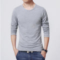 Young men's solid colour linen base shirt in black, sleeveless with striped pattern, worn as casual vest layering piece